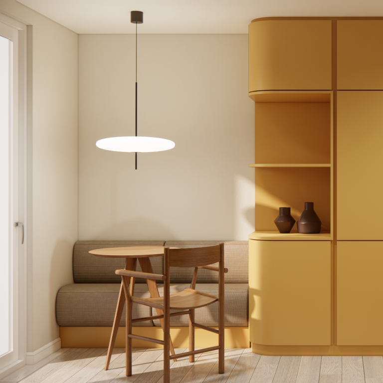 Helle Essecke mit Holzstuhl, runder Tisch und einem Einbaumöbel in warmen Gelbtönen.